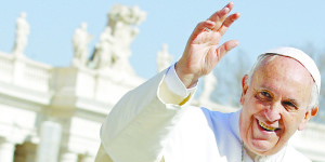 Francis waves as he leads the weekly audience in Saint Peter's Square at the Vatican